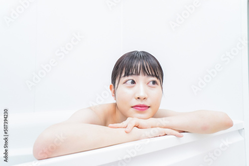 Young woman in the bath