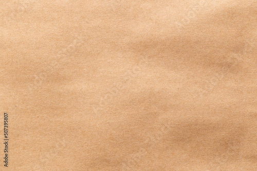 Brown eco recycled kraft paper sheet texture cardboard background.