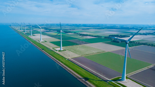 Photos Windmill park in the ocean, drone aerial view of windmill turbines generating green energy electric, windmills isolated at sea in the Netherlands