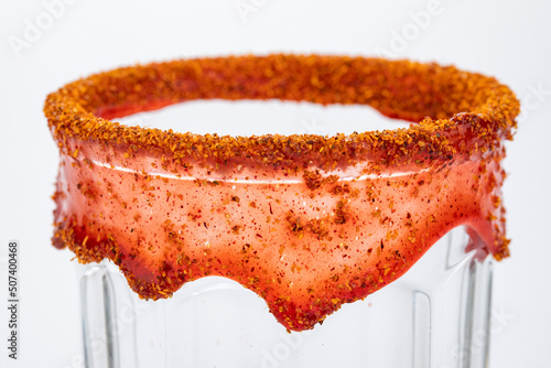 Glass garnished  with chamoy and chili powder for Mexican michelada photo