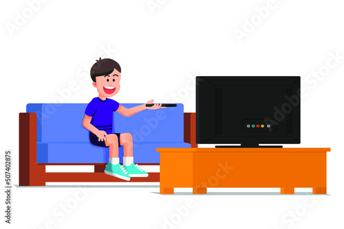 Tableau sur toile a happy boy watching television while sitting on the sofa