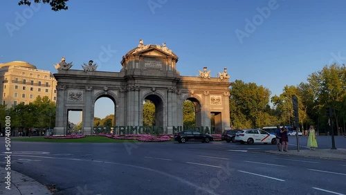 Beautiful view of the iconic (Puerta de alcala) alcala gate in spring, cover in flowers on a sunset in Madrid  Spain