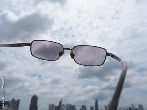 sunglasses on the sky background