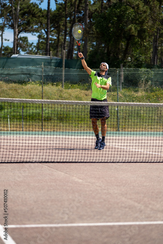 Tennis player performing a smash © homydesign