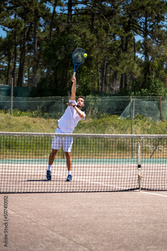 Tennis player performing a smash