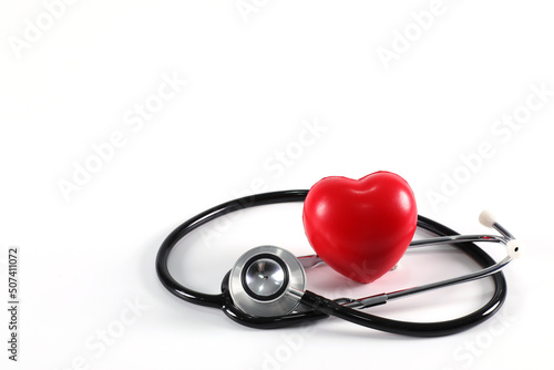 Stethoscope with red heart on white background, heart examination, medical equipment the doctor used to examine the patient have copy space.