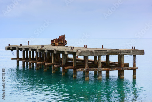 Old abandoned pier in the sea. Sochi, the seashore of the village of Dagomys.