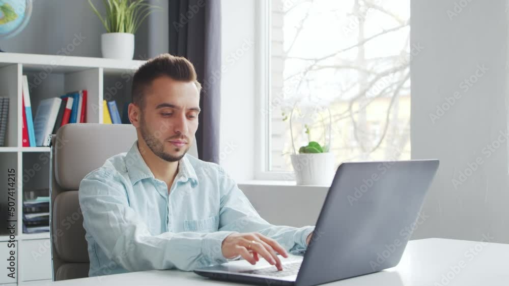 Young Teacher makes an Online Lesson while Sitting in Front of Computer at Home. The Workplace of the Tutor for School Lessons. Distant Study and Education Concept. Young Teacher makes an Online Lesson while Sitting in Front of Computer at Home. The Workplace of the Tutor for School Lessons. Distant Study and Education Concept.