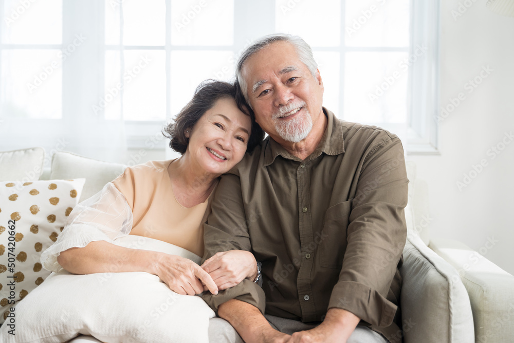 Obraz premium Asian senior couple smiling at the camera. Family mature couple portrait