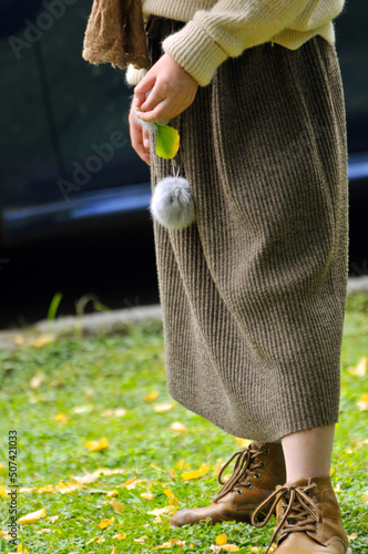 a young girl walking in the grass