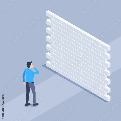 isometric vector illustration on a gray background, a man in business clothes stands in the way blocked by a brick wall, problems and obstacles on the way to success photo