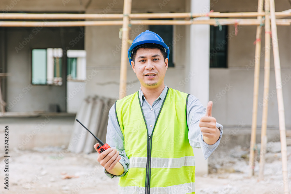 Fototapeta premium worker foreman home builder hand sign thumbs up for good pass build and safety quality confirm concept.