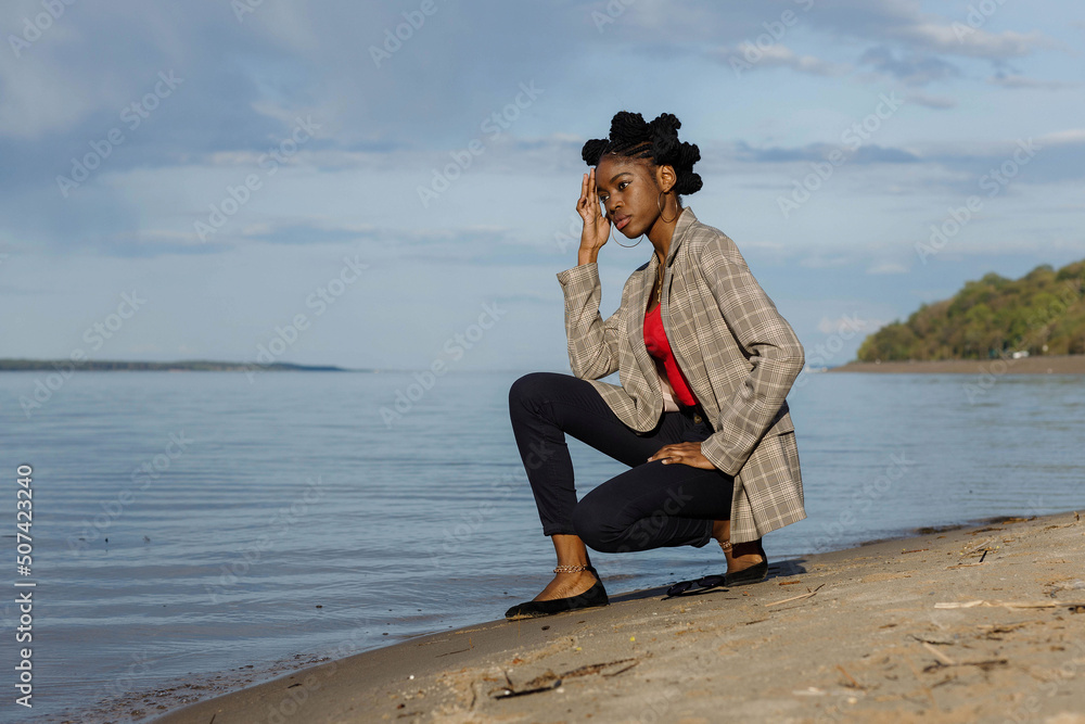 African girl on the background of Cheboksary reservoir