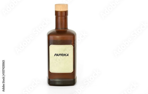 Herbal tincture in a antique retro bottle. Herbs medical solution of Paprika