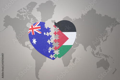 puzzle heart with the national flag of palestine and australia on a world map background. Concept.