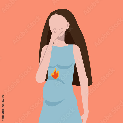 Heartburn during pregnancy, difficulties during pregnancy, a young pregnant woman in a blue dress