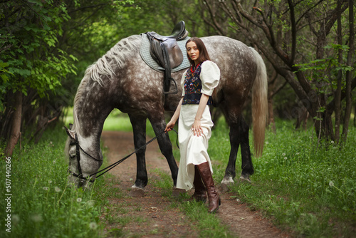 Beautyful woman with horse in Ukrainian national dress   © Maksym Dykha