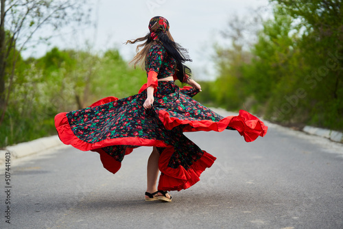 Gypsy girl dancing in the street photo