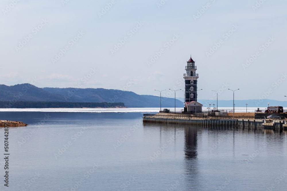 Lighthouse in the harbor of Lake Baikal near the village of Turka on a spring day