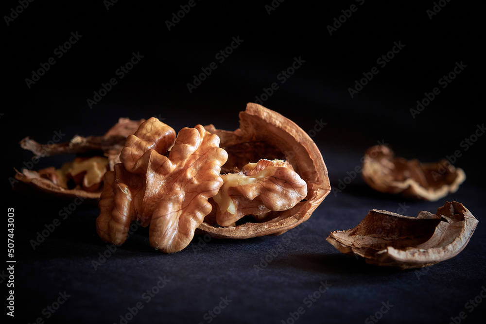 split walnut close-up on a dark background split walnut close-up on a dark background