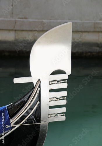 Bow of Gondola with metal six fingers on the left that represents the neighborhoods of Island Venice in Italy