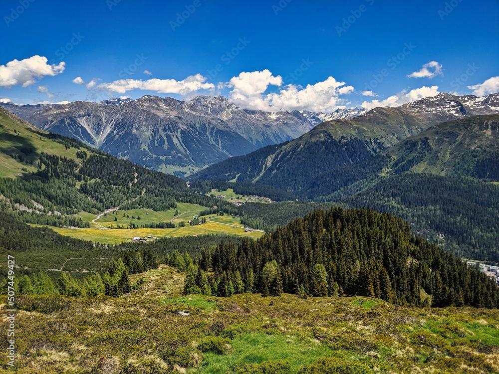 View of Laret Davos from the Parsenn. Hiking in spring in the mountains of Graubunden. Davos Klosters Mountains. 
