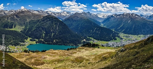 Panoramic view of lake davos. Fantastic mountains in spring. Hiking  trail running  mountain biking. Parsenn Switzerland