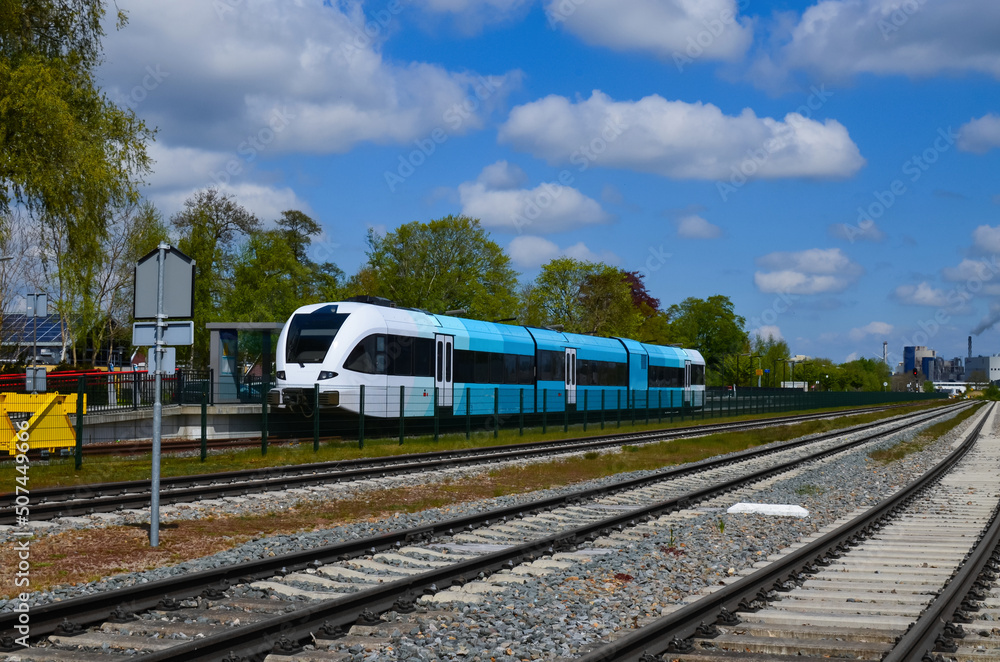 Fototapeta premium Railway lines and modern train on sunny day