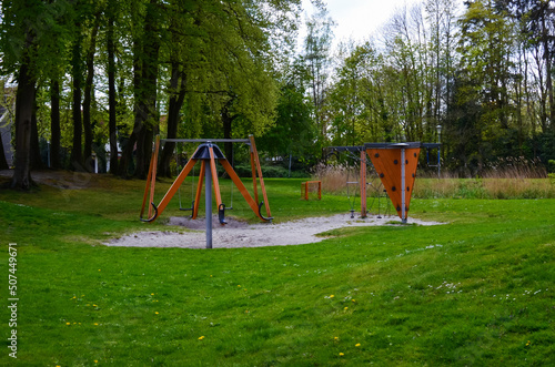 Beautiful green park with empty children's playground