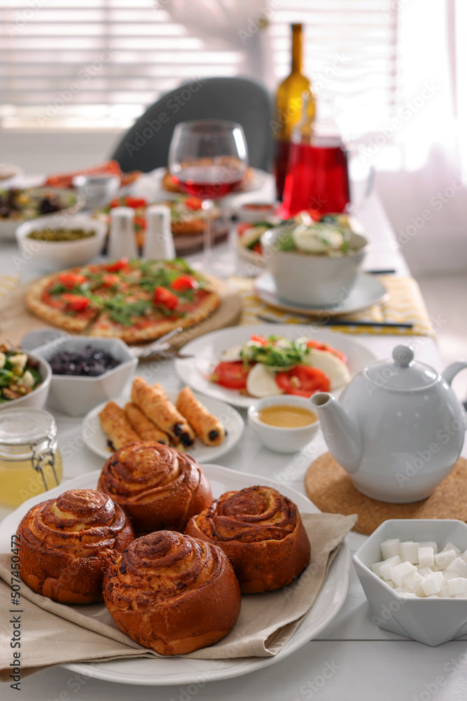 Delicious buns and many different dishes served on buffet table for brunch Delicious buns and many different dishes served on buffet table for brunch
