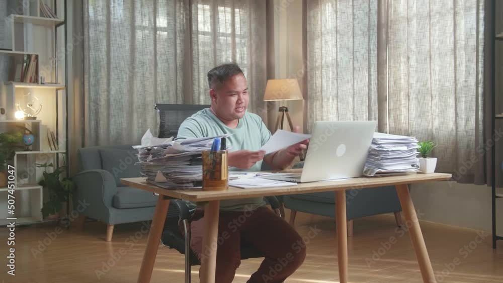Fat Asian Man With Documents Explaining Work On Paper While Having Video Call On Laptop At The Office
Fat Asian Man With Documents Explaining Work On Paper While Having Video Call On Laptop At The Office