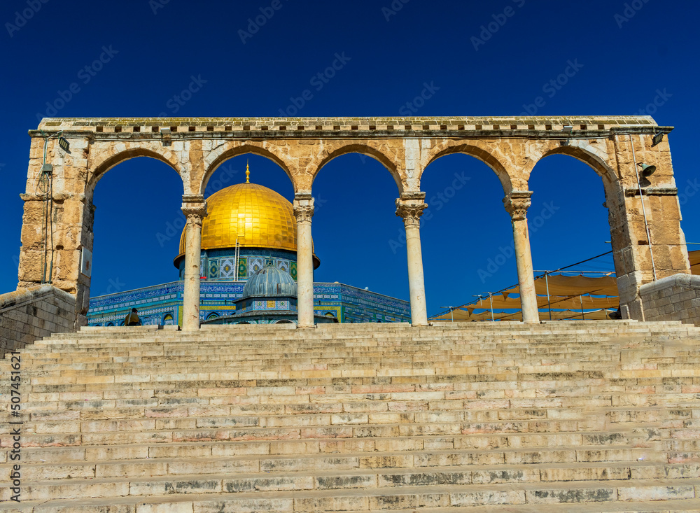 Jerusalem, Israel - June 10 2019: View of the imposing Dome of the Rock through an arch