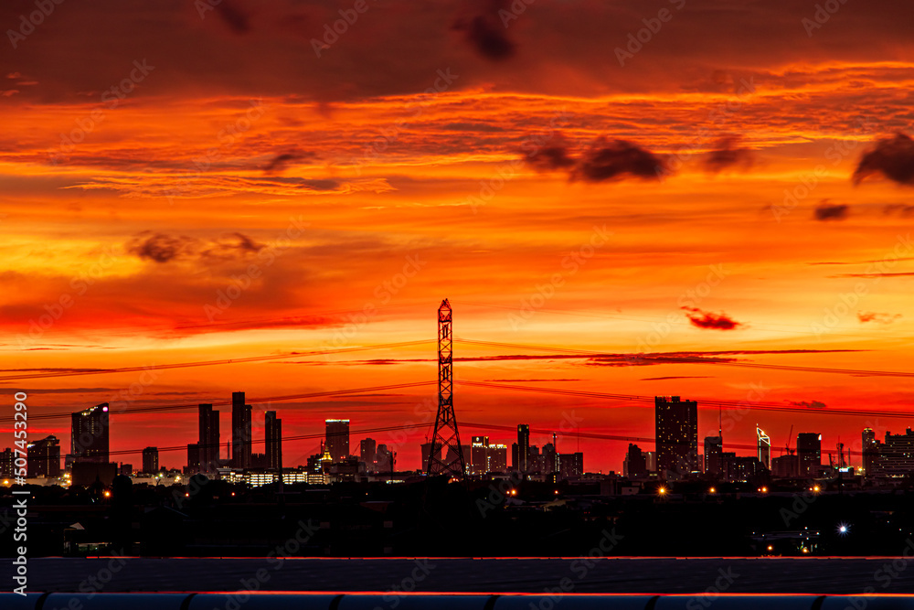 Sunset over the city with black silhouettes of buildings Sunset over the city with black silhouettes of buildings