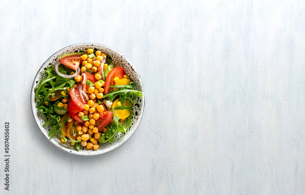 Summer healthy vegetables salad with cucumber, chickpeas and tomato. Healthy food.Top view.