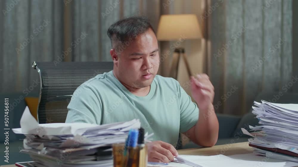 Tired Fat Asian Man Putting Hand On Cheek While Working Hard With Documents At The Office
Tired Fat Asian Man Putting Hand On Cheek While Working Hard With Documents At The Office
