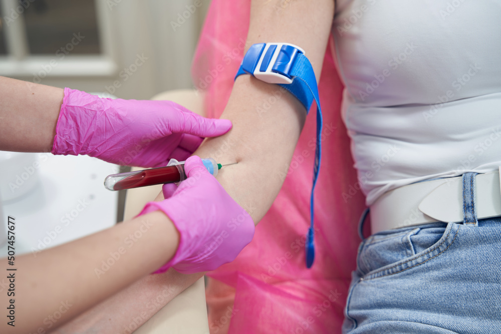 Obraz premium Unrecognized client donating blood in medicine center