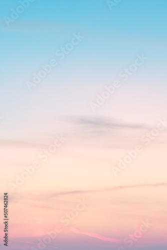 Vertical ratio size of sunset background. sky with soft and blur pastel colored clouds. gradient cloud on the beach resort. nature. sunrise. peaceful morning. Instagram toned style
