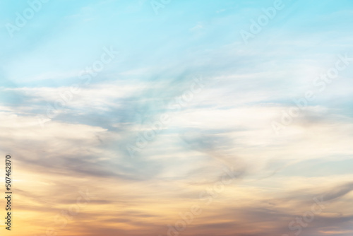 sunset background. sky with soft and blur pastel colored clouds.  gradient cloud on the beach resort. nature. sunrise.  peaceful morning. Instagram toned style © flowertiare