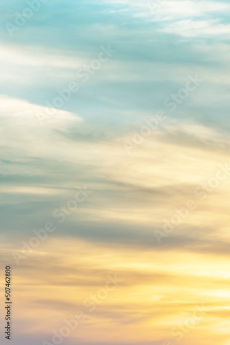 Vertical ratio size of sunset background. sky with soft and blur pastel colored clouds. gradient cloud on the beach resort. nature. sunrise. peaceful morning. Instagram toned style