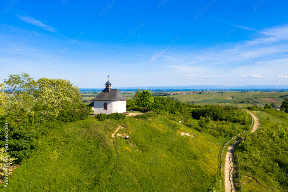 Aerial view from nature reserve
the little Kalmit. Is located in the east of the Palatinate Forest near the wine and holiday resort of Ilbesheim. A small chapel on the hilltop. Rhineland-Palatinate.