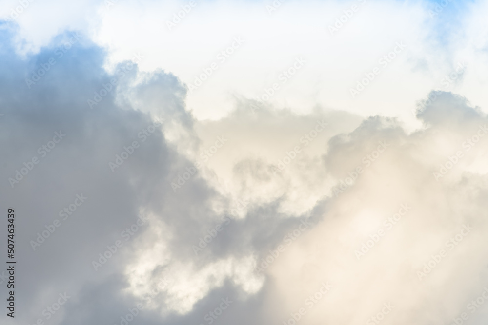 Obraz premium Twilight sky with effect of light pastel colors. Colorful sunset of soft clouds.