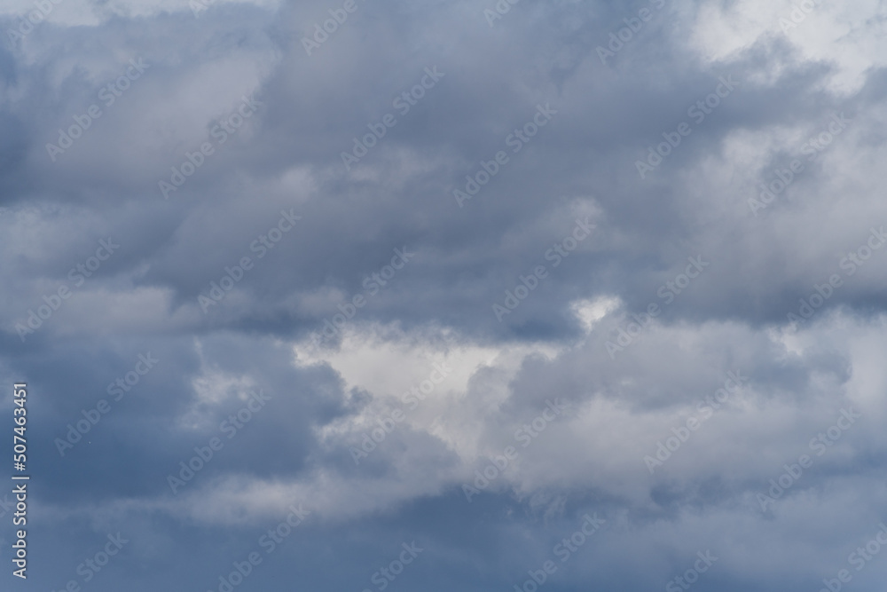 Gray overcast cloudy sky over horizon. Closeup clouds Gray overcast cloudy sky over horizon. Closeup clouds