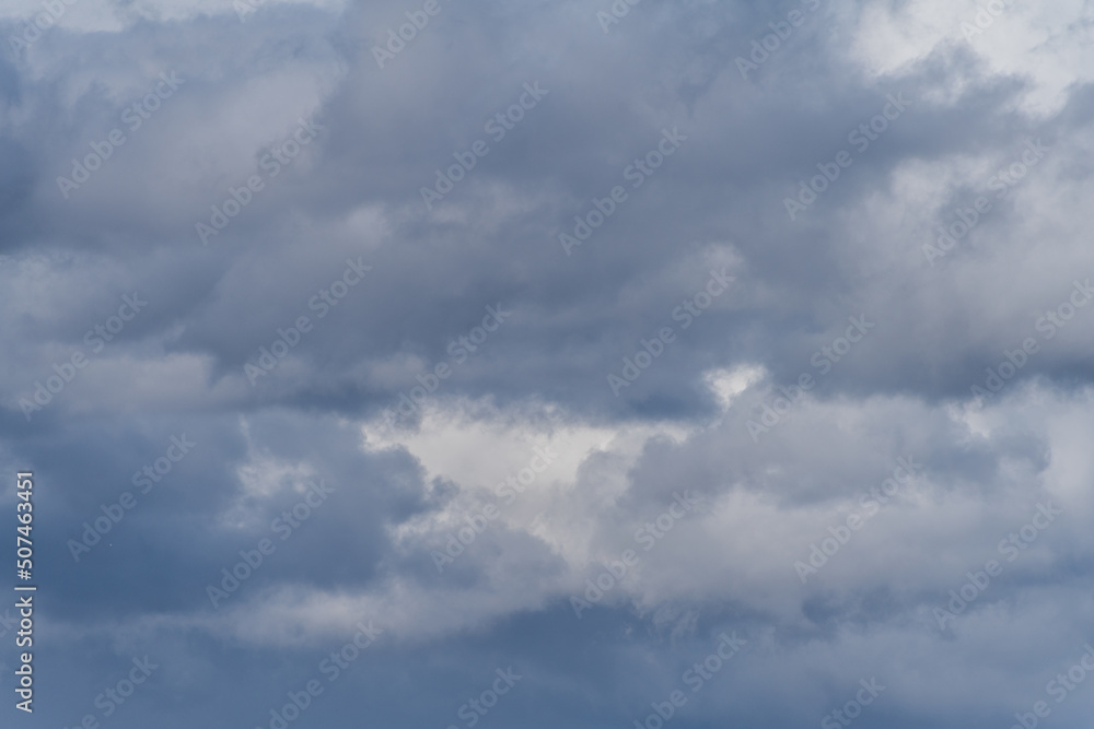 Gray overcast cloudy sky over horizon. Closeup clouds