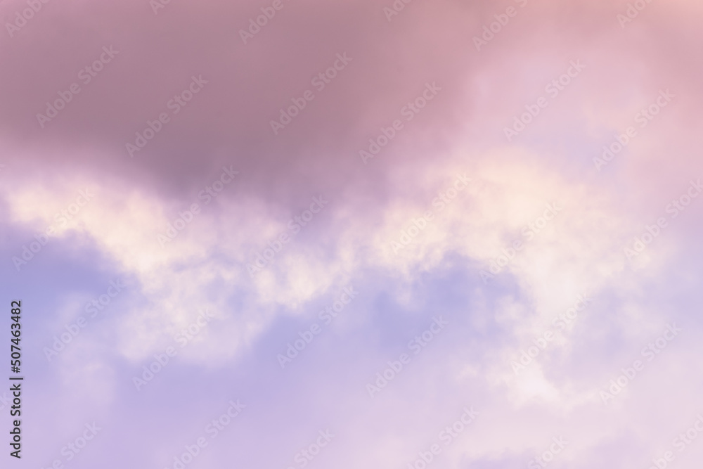 Twilight sky with effect of light pastel pink colors. Colorful sunset of soft clouds.