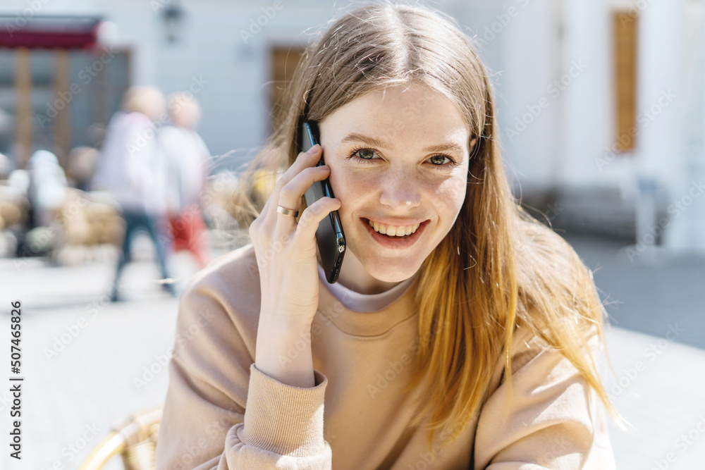 Portrait of a freelance woman using a phone talking. Portrait of a freelance woman using a phone talking.