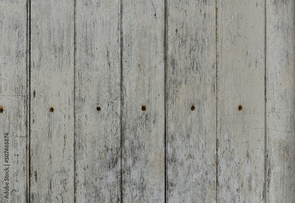 Obraz premium Texture&nbsp;of&nbsp;stained&nbsp;vertical&nbsp;planks&nbsp;facade.&nbsp;Old&nbsp;dirty&nbsp;rough&nbsp;siding&nbsp;of&nbsp;gnarled&nbsp;surface&nbsp;rural&nbsp;country&nbsp;wooden&nbsp;paneling.&nbsp;Messy&nbsp;aged&nbsp;laths.&nbsp;&nbsp;Rustic&nbsp;grungy&nbsp;ranch&nbsp;lumber&nbsp;fence&nbsp;of&nbsp;hard&nbsp;boards&nbsp;for&nbsp;barn&nbsp;design