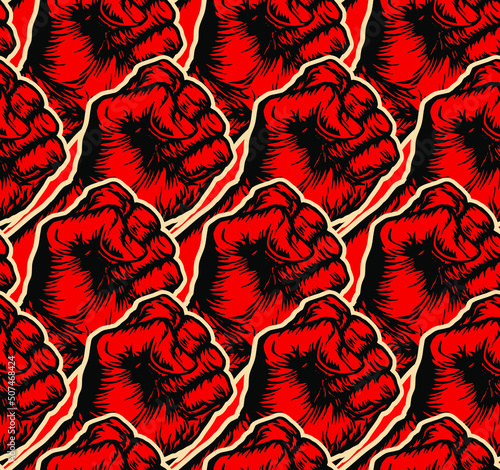 Vector seamless pattern of people raised red right fists in the style of soviet propaganda posters.