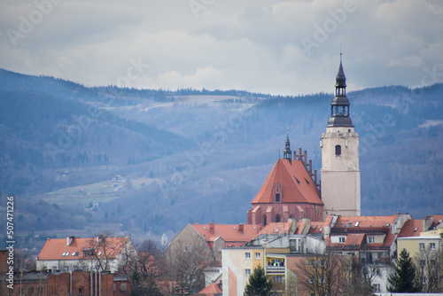 town, historic church with mountains in the background