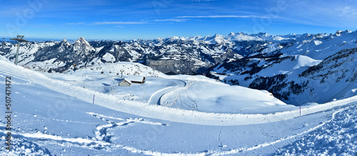 Snowed ski slopes and mountain ridges in Swiss Alps. Top of the glacier panorama. Switzerland.  © Alexandru V