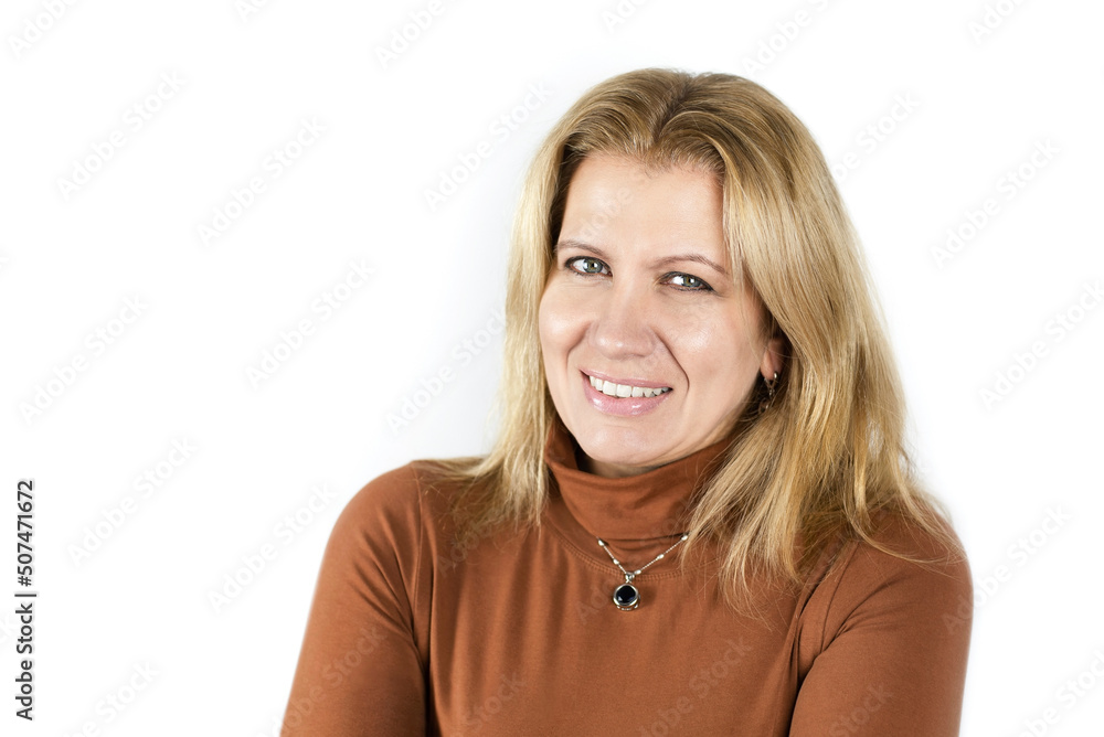 Portrait of a happy woman with a beautiful smile and blond painted hair, well-groomed skin on a light background, the concept of health, pleasure in middle-aged women Portrait of a happy woman with a beautiful smile and blond painted hair, well-groomed skin on a light background, the concept of health, pleasure in middle-aged women